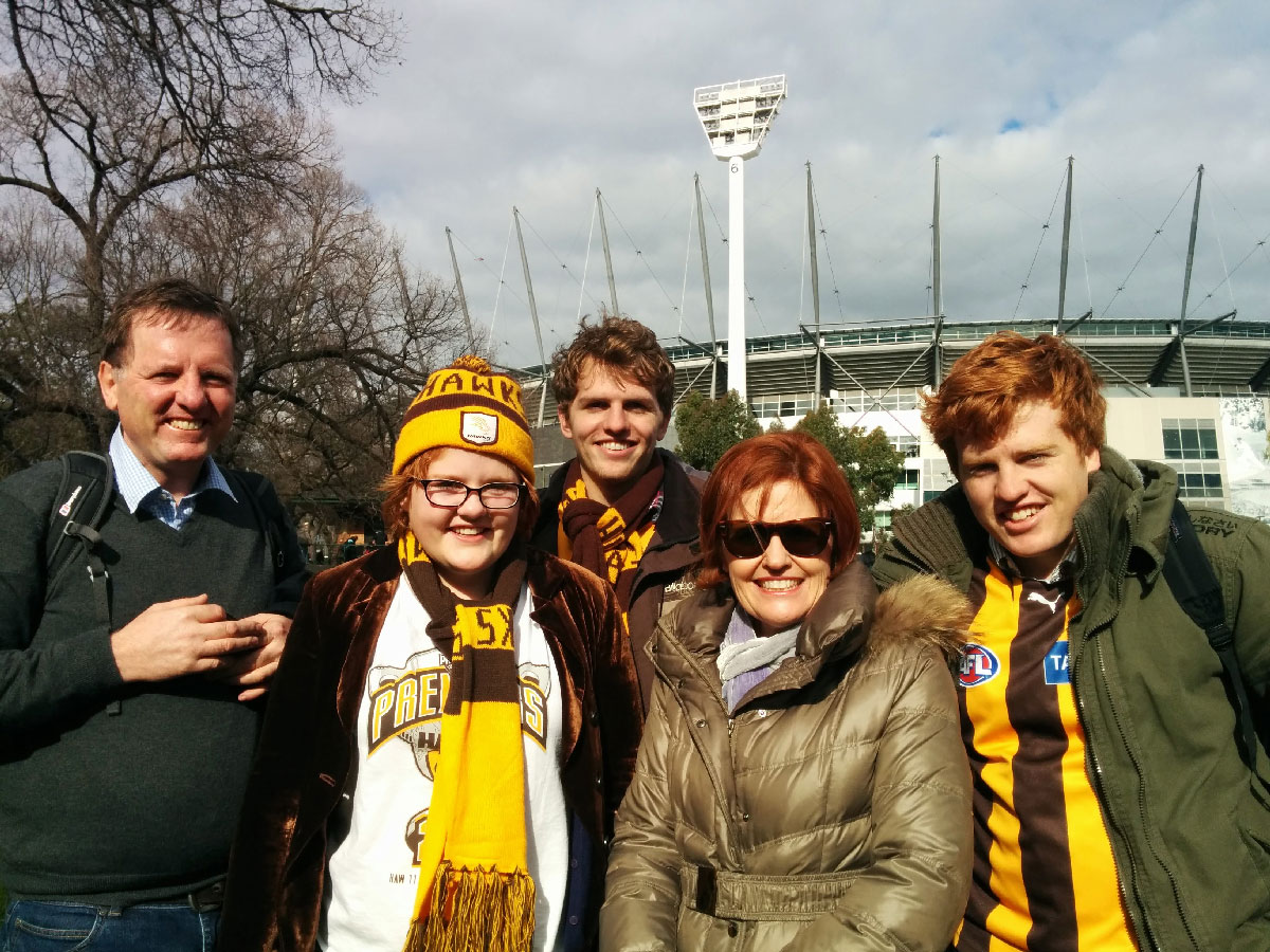 Richard Murray and his family dressed in Hawks gear at the MCG
