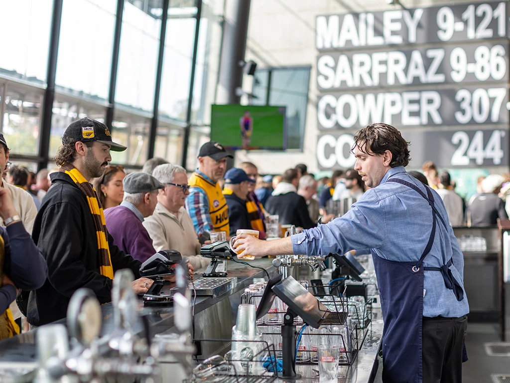Patrons being served drinks at the Percy Beames Bar