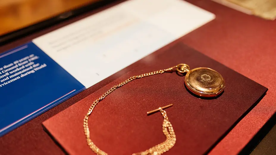 Museum display with fobwatch, inscribed