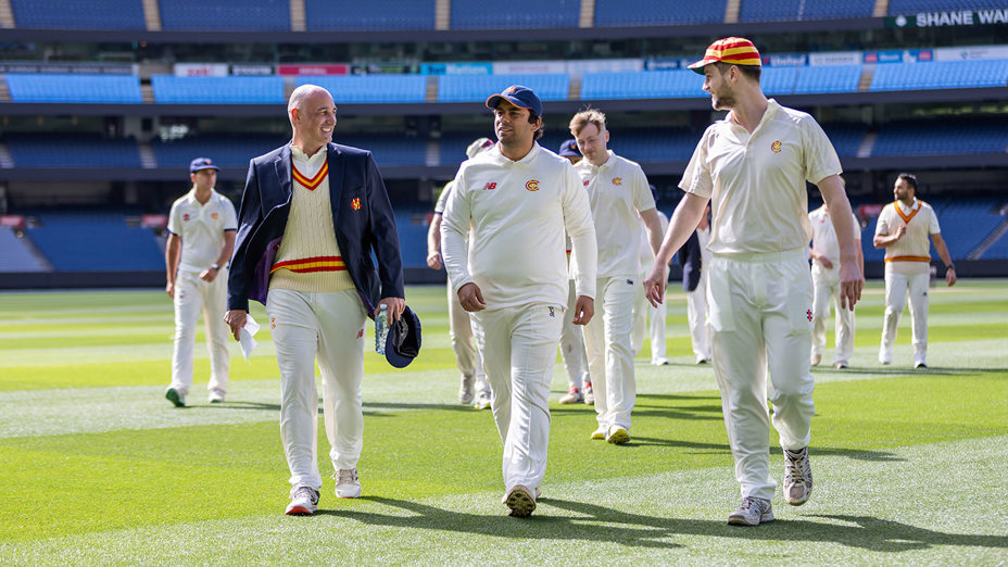 Marylebone cricket team walk across the MCG turf