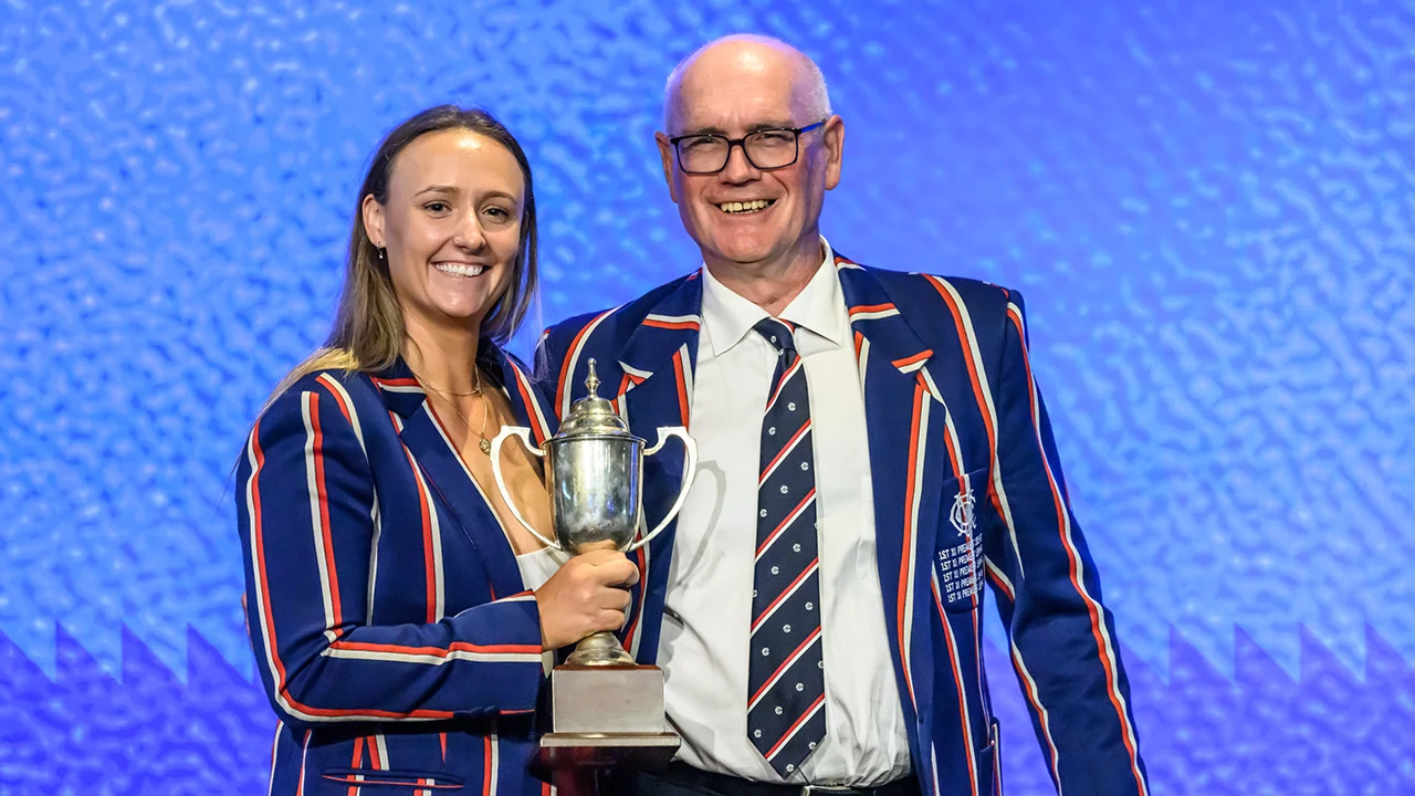 Bob Lloyd presents Amy Yates with trophy