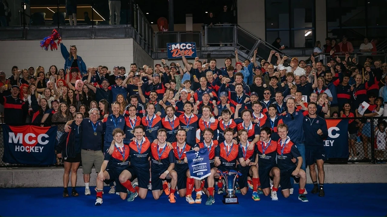 MCC Men's Premier team 2026 premiership photo backed by supporters