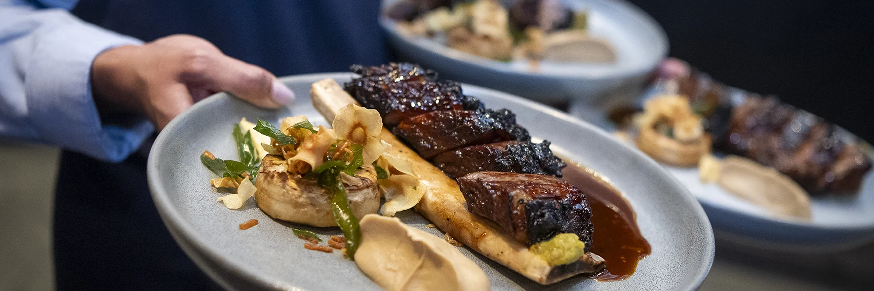 Plated mains being served