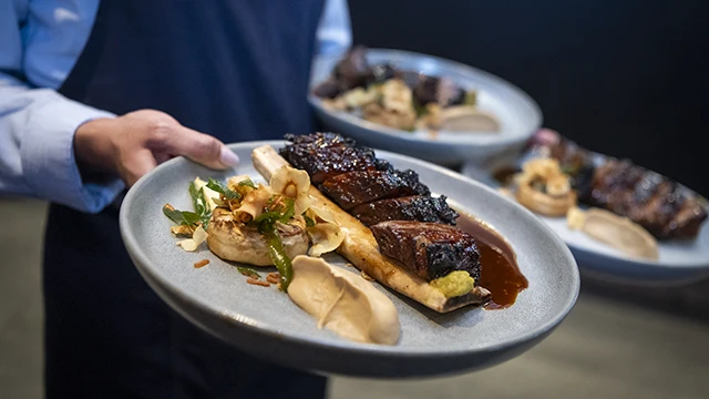 Plated mains being served