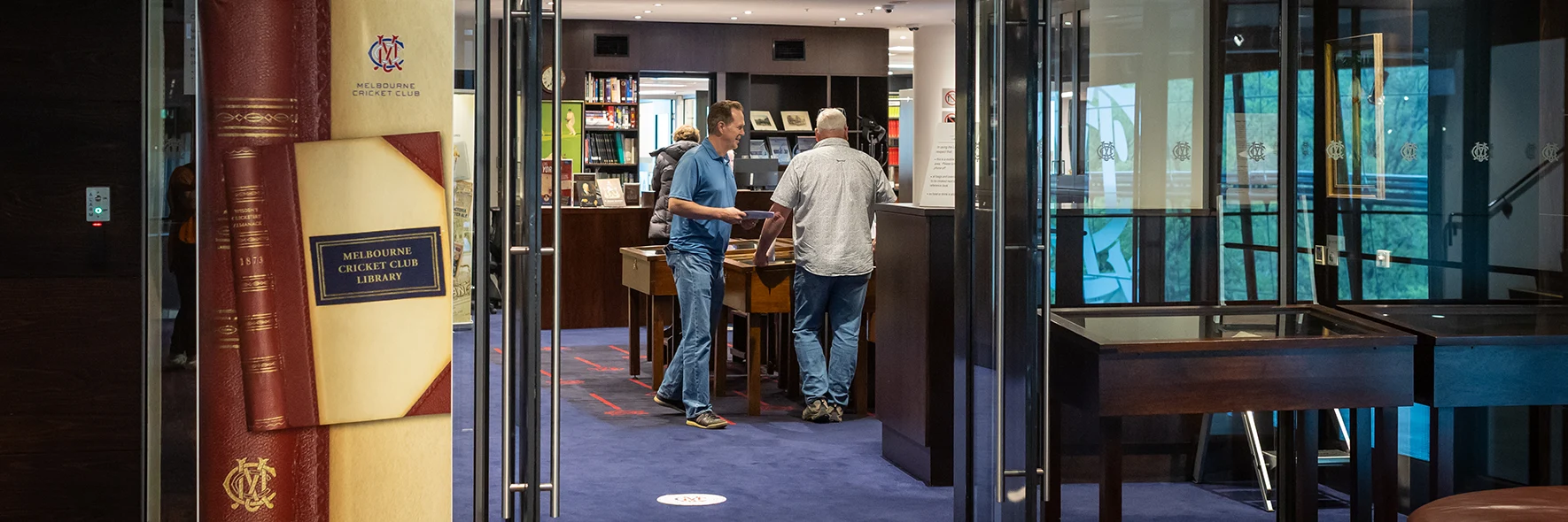 Patrons browse books in the MCC Library
