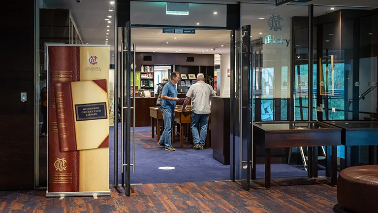 Patrons browse books in the MCC Library