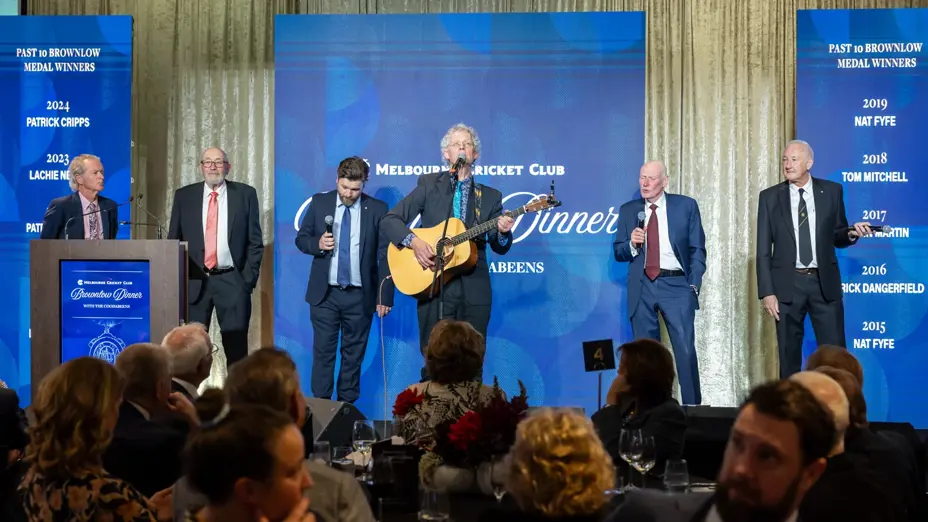 Comedy music group performs on stage at the MCC Brownlow Dinner with the Coodabeens