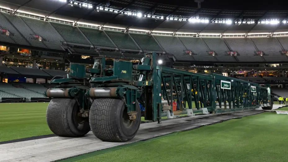 Large machinery positioned on the MCG arena under lights