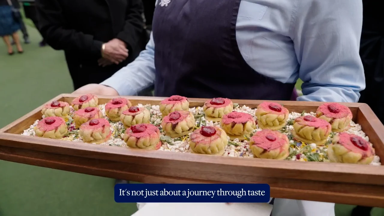 Tray of artful desserts. Caption reads "It's not just about a journey through taste".
