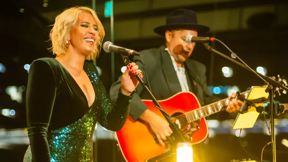 A singer and guitarist performing live